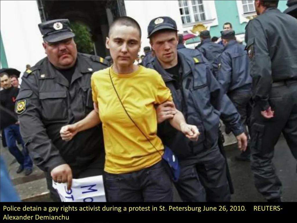police detain a gay rights activist during