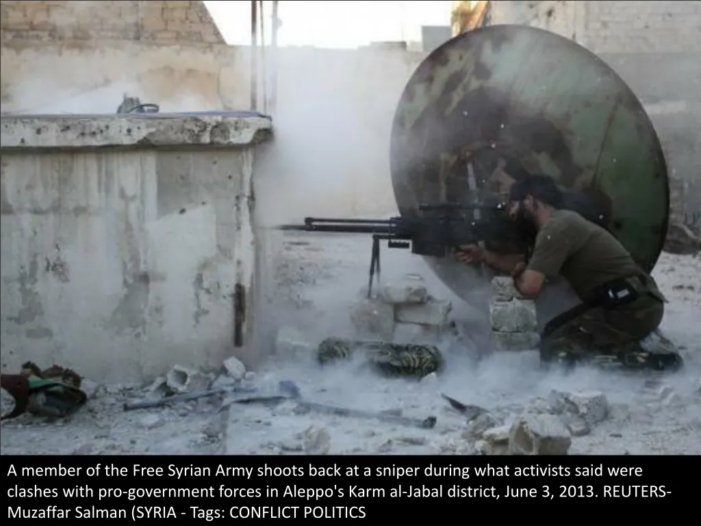 a member of the free syrian army shoots back