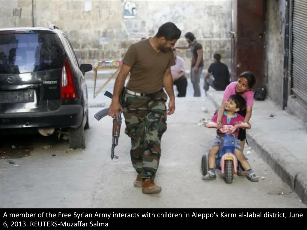 a member of the free syrian army interacts with