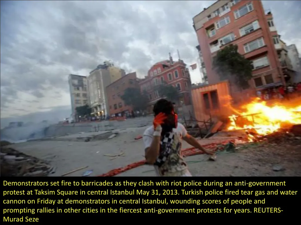 demonstrators set fire to barricades as they