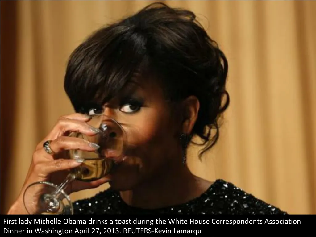 first lady michelle obama drinks a toast during