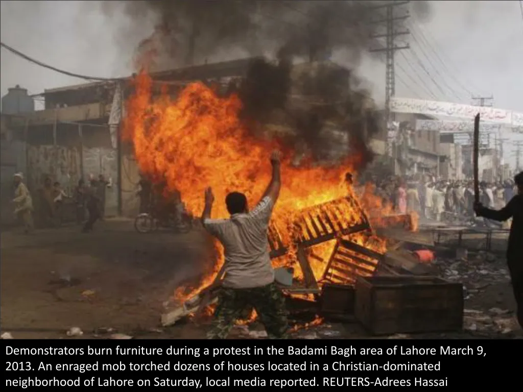 demonstrators burn furniture during a protest