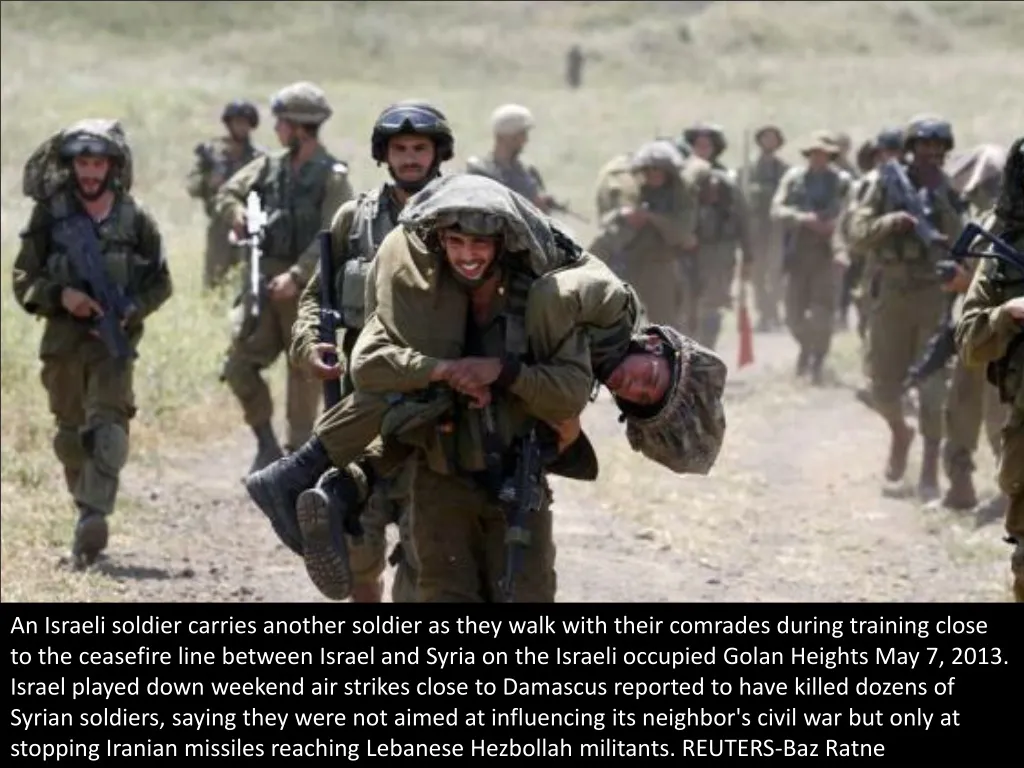 an israeli soldier carries another soldier