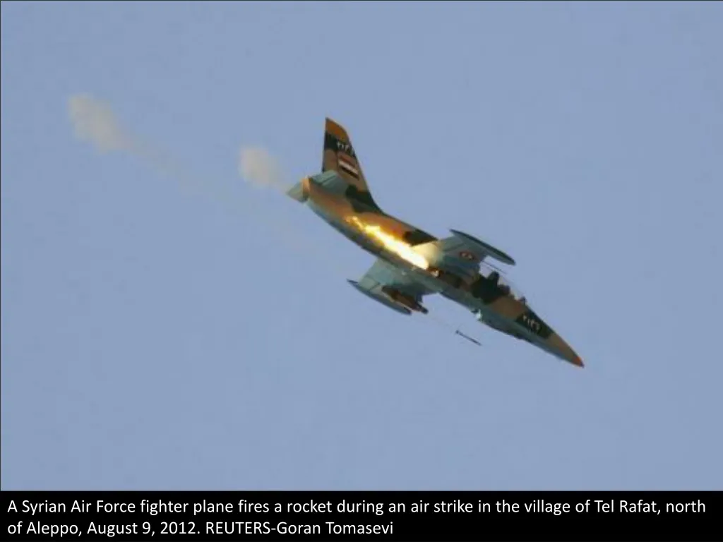 a syrian air force fighter plane fires a rocket