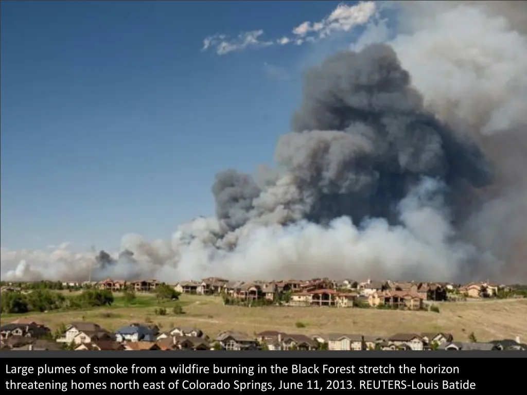 large plumes of smoke from a wildfire burning