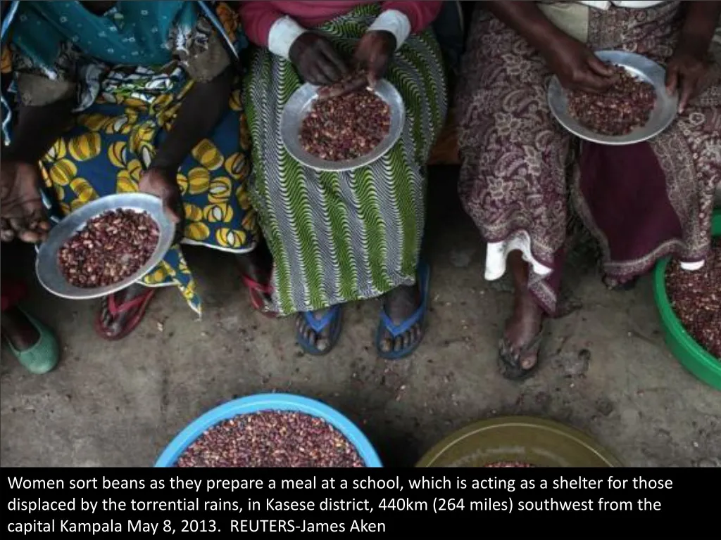 women sort beans as they prepare a meal
