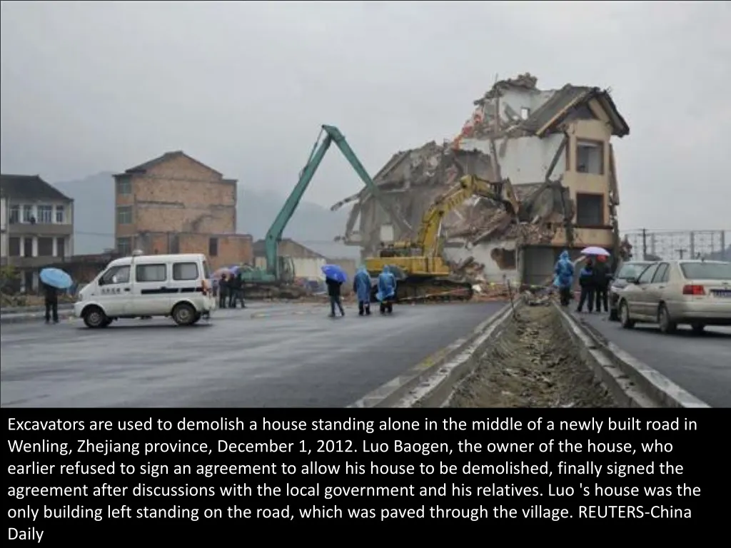 excavators are used to demolish a house standing