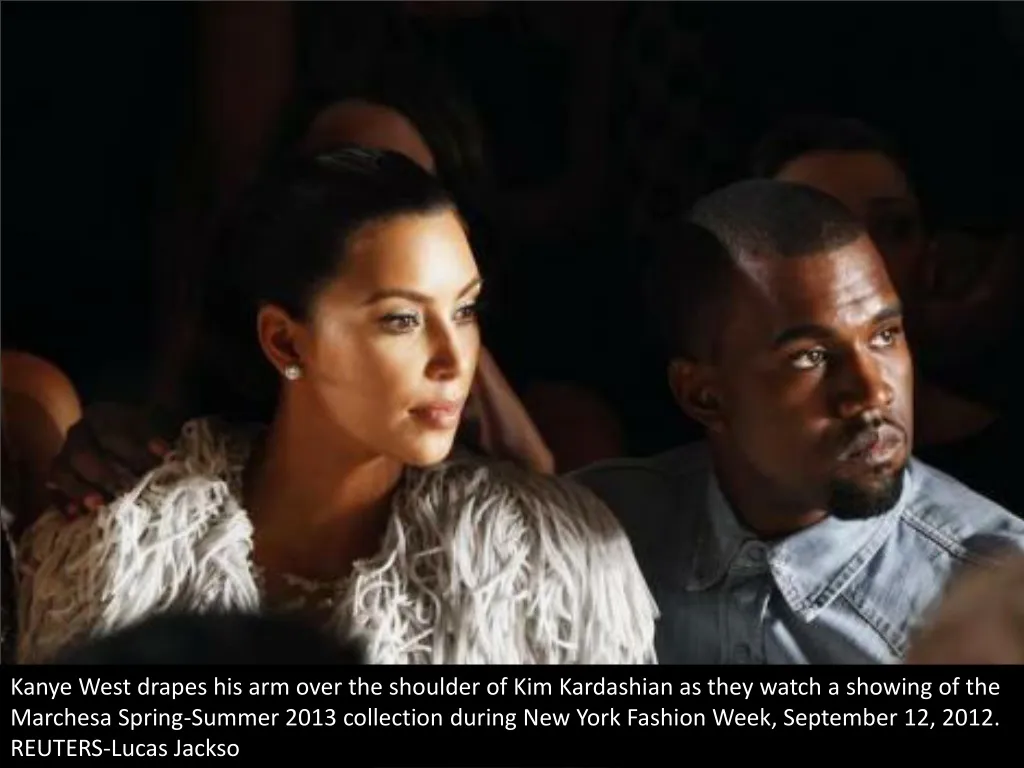 kanye west drapes his arm over the shoulder