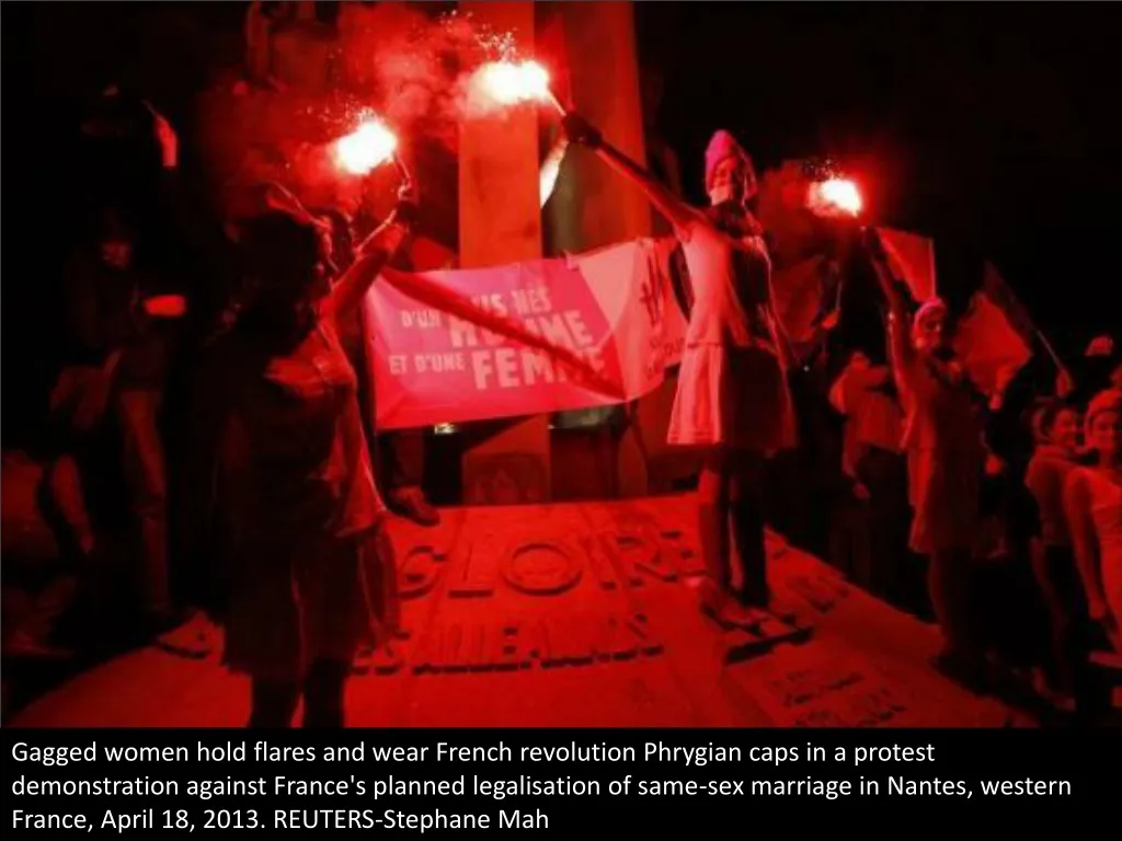 gagged women hold flares and wear french