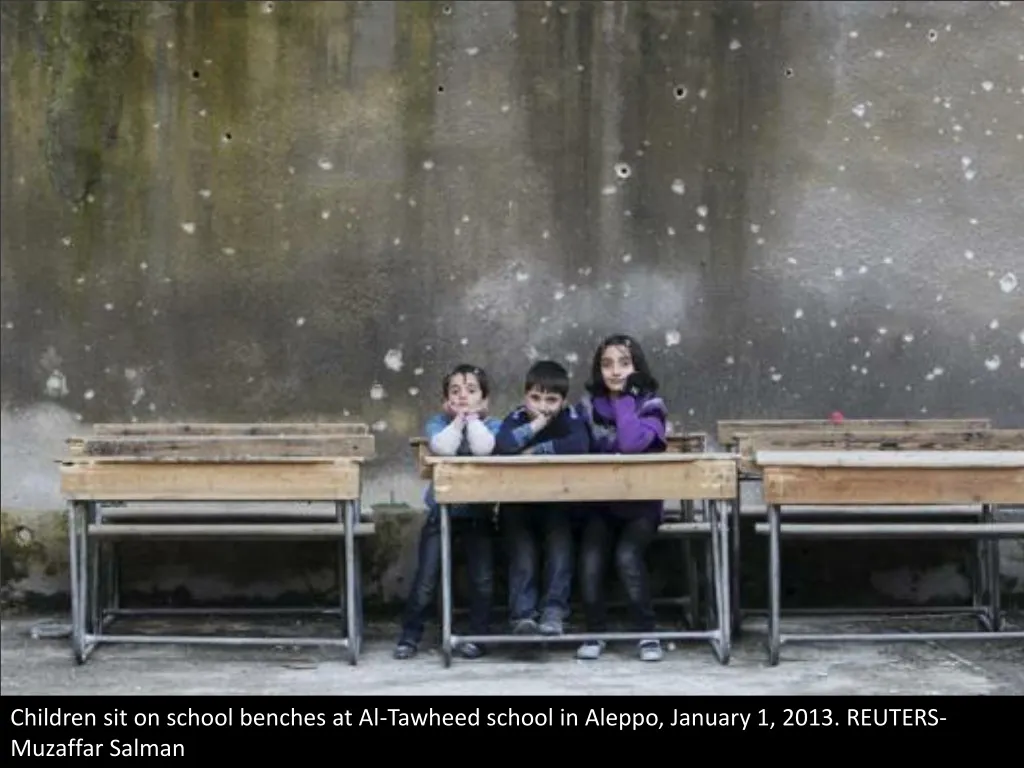 children sit on school benches at al tawheed