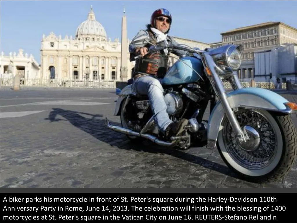 a biker parks his motorcycle in front of st peter
