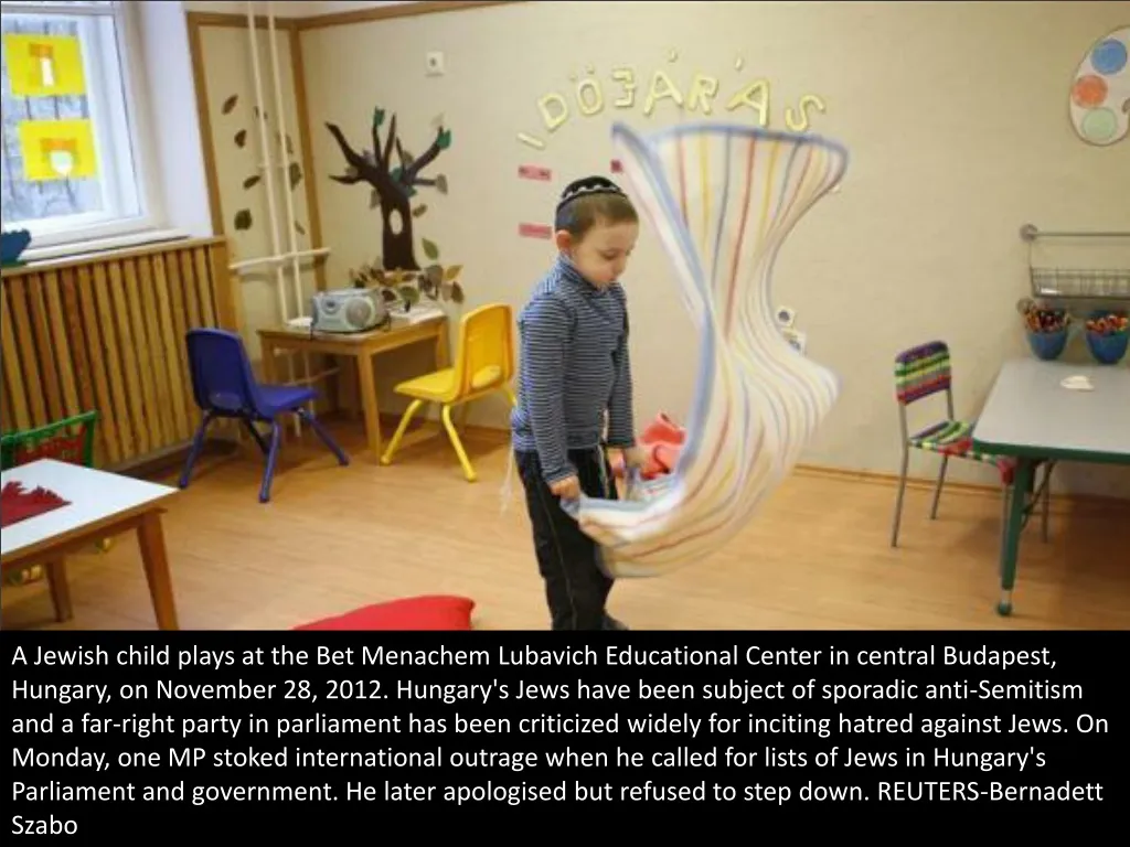 a jewish child plays at the bet menachem lubavich