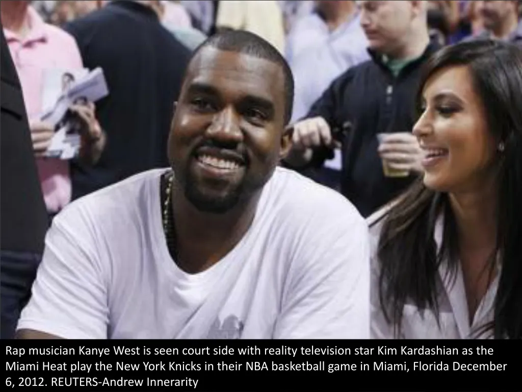 rap musician kanye west is seen court side with