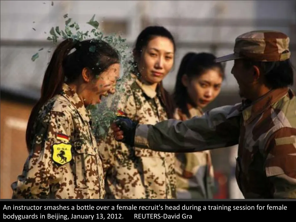 an instructor smashes a bottle over a female