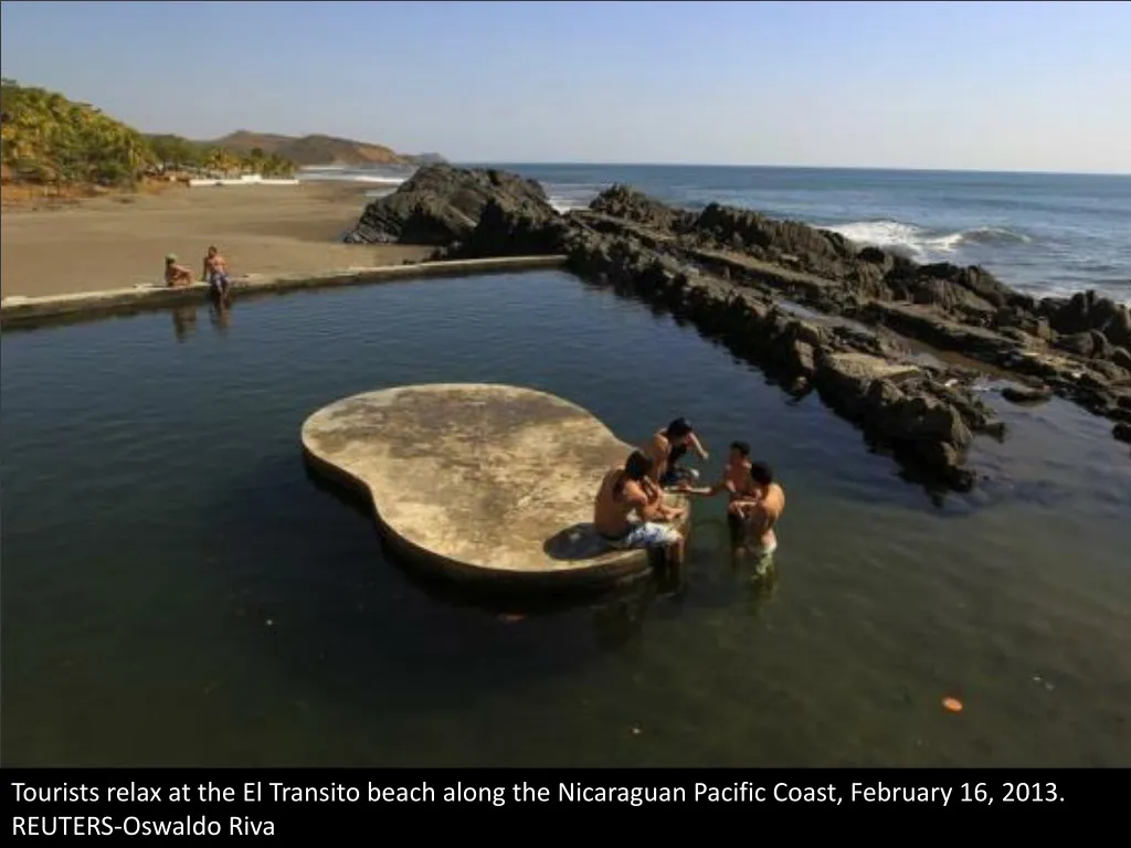 tourists relax at the el transito beach along