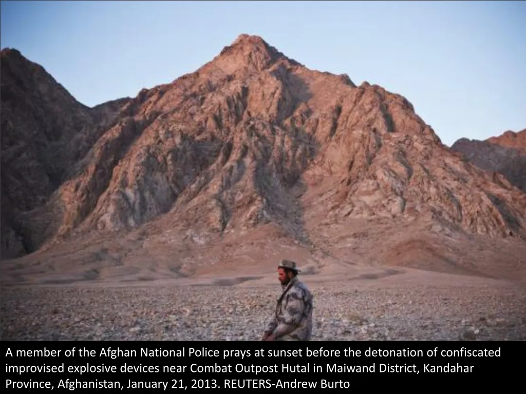 a member of the afghan national police prays