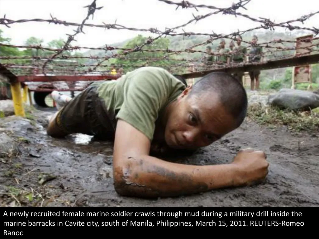 a newly recruited female marine soldier crawls