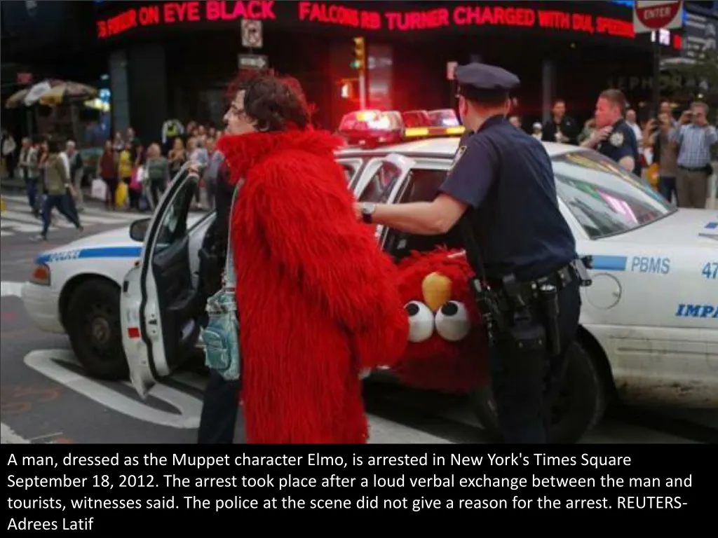 a man dressed as the muppet character elmo