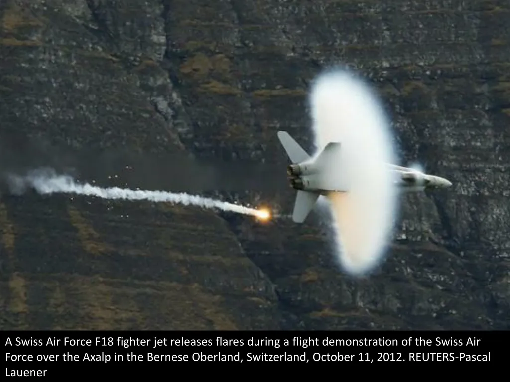 a swiss air force f18 fighter jet releases flares