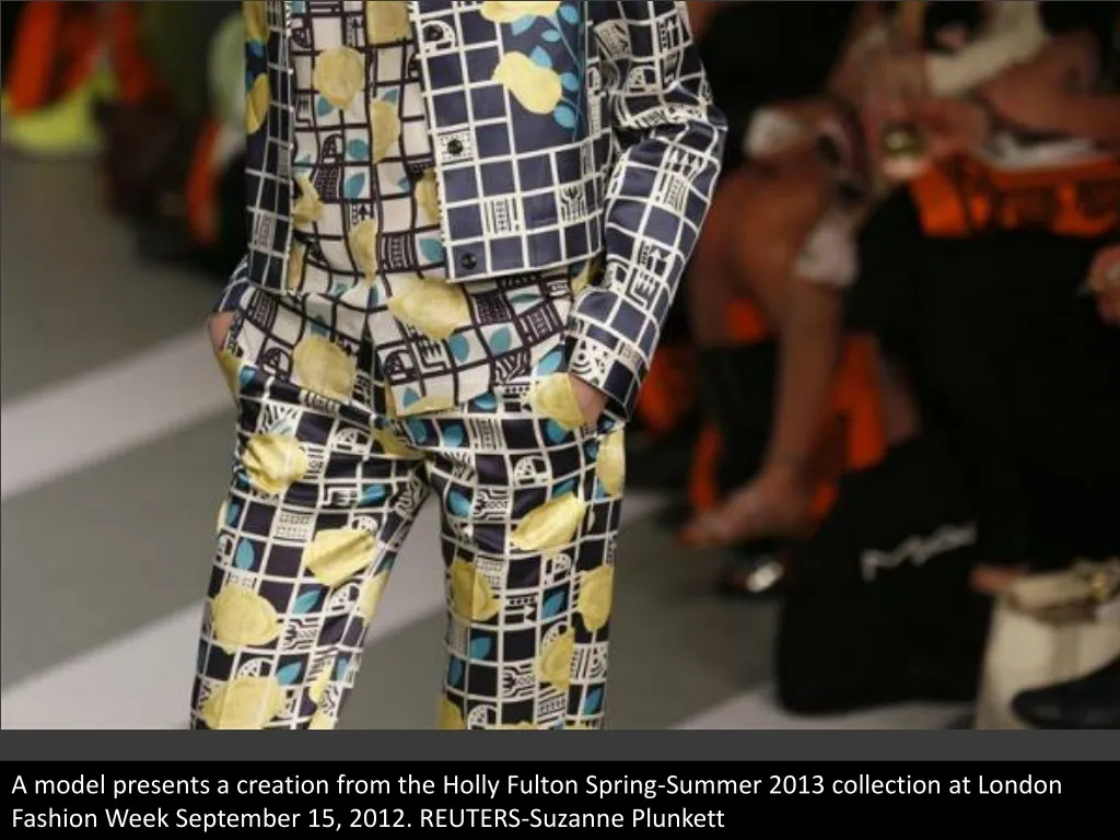 a model presents a creation from the holly fulton