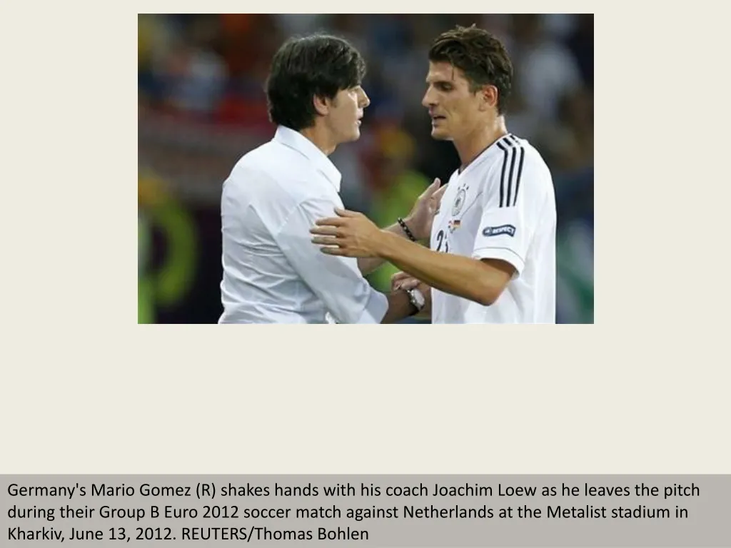 germany s mario gomez r shakes hands with