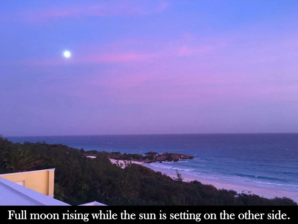 full moon rising while the sun is setting
