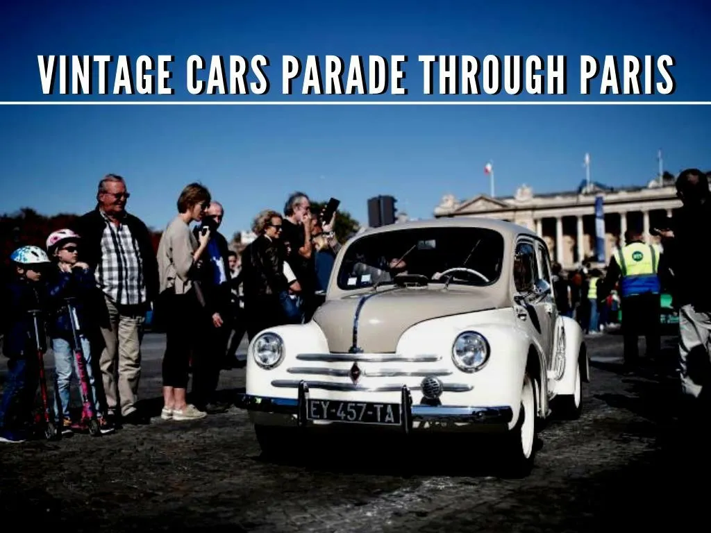 vintage cars parade through paris